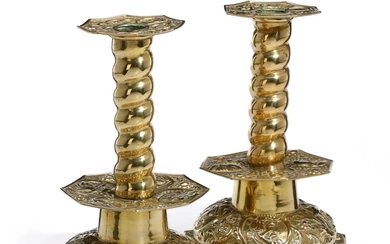 A pair of Frisian Baroque c. 1700 brass candlesticks embossed with male...