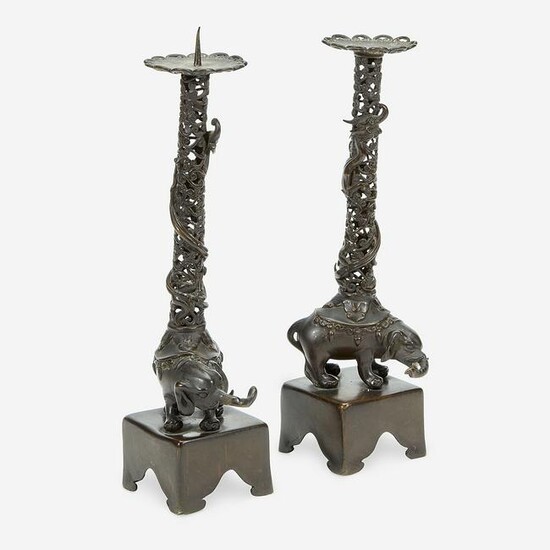 A pair of Japanese "Elephant and Dragon" candlesticks