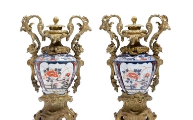 A pair of Japanese Imari porcelain covered vases