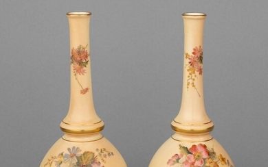 A pair of Royal Worcester bottle form vases, 6 3/4 in. (17.1 cm.) h.
