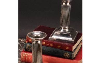 A pair of Victorian silver fluted Doric column candlesticks,...