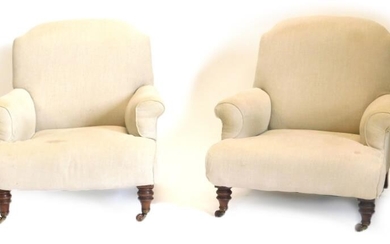 A pair of Victorian walnut Howard type armchairs, each...