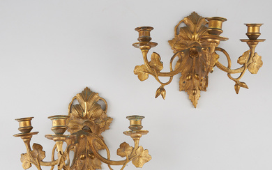 A pair of burnt-gilt bronze sconces, second half of the 19th century.