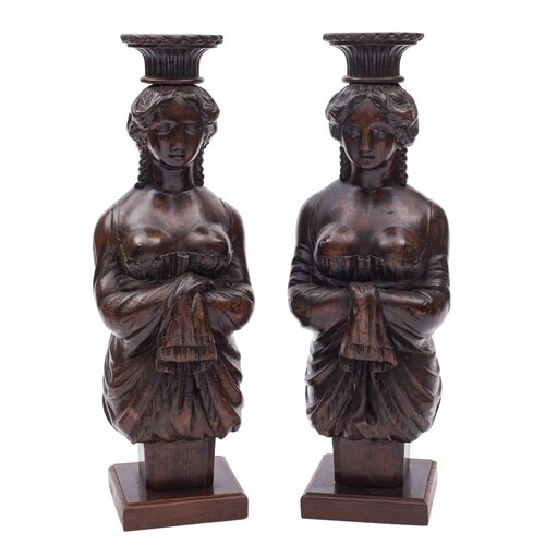 A pair of carved wooden figure head style candle stands:, ea...