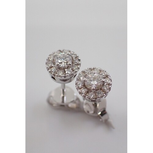 A pair of diamond stud cluster earrings, total estimated wei...