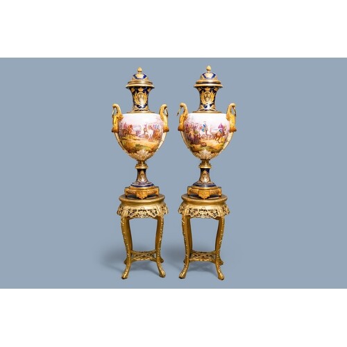 A pair of massive French Sèvres-style vases with gilded bron...