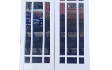 A pair of painted French doors with astragal glazed panels...