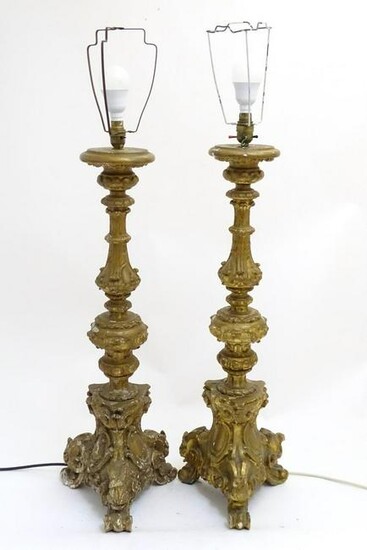 A pair of rococo style table lamps, constructed of