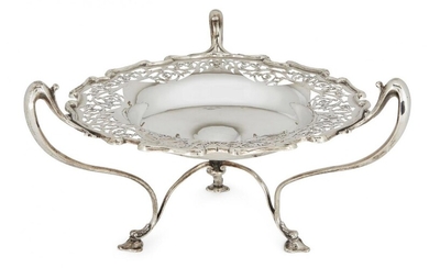 A pierced Edwardian silver tazza, London, c.1908, Goldsmiths & Silversmiths Co., designed with three bifurcated handles to trefoil pad feet, the shaped rim to pierced edge and plain base with concave centre, 17cm high, 30cm dia. (to handles)...