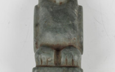 A pre-Columbian Olmec style carved green hardstone ear perforator, probably 900-450 BC, the finial m