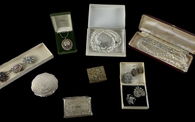 A quantity of costume jewellery including pearls, brooches, marcasite brooches,...