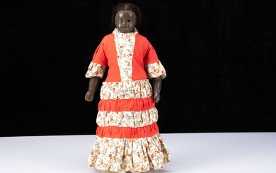 A rare 19th century English black poured wax child doll