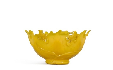 A rare reticulated yellow glass 'lotus' bowl, Qing dynasty, 18th century | 清十八世紀 黃料一甲連科紋盌