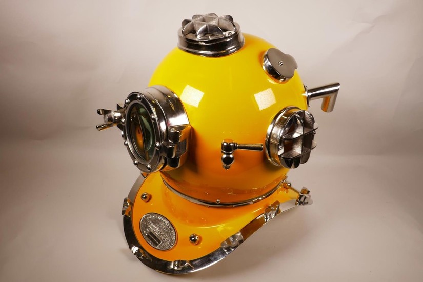 A replica chrome and yellow enamelled USA diver's helmet, 17...