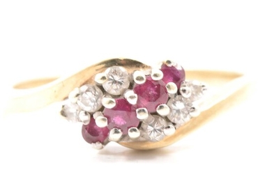 A ruby and diamond crossover ring.