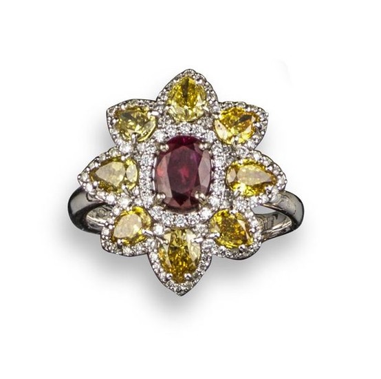 A ruby and fancy diamond cluster ring, of...