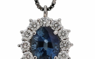 SOLD. A sapphire and diamond necklace with a pendant set with a sapphire encircled by...