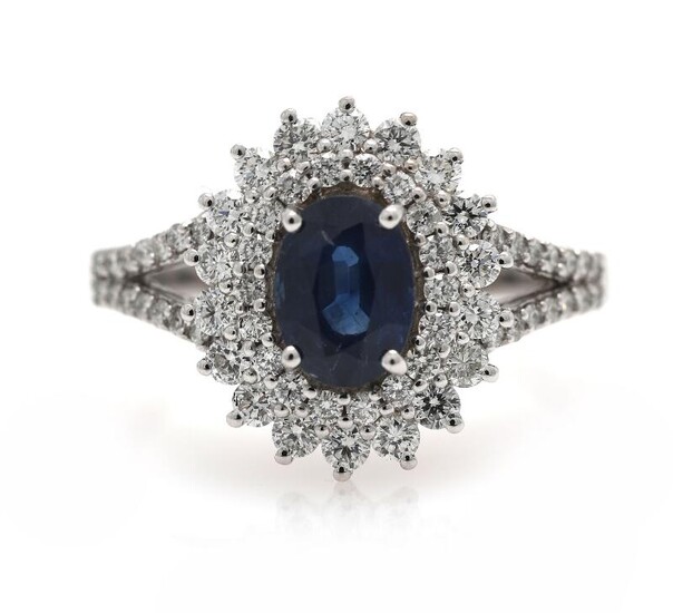 A sapphire ring set with a sapphire weighing app. 1.08 ct. encircled by diamonds, mounted in 18k white gold. Size app. 54. – Bruun Rasmussen Auctioneers of Fine Art