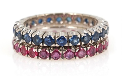 A set comprising two eternity rings respectively set with numerous circular-cut rubies...