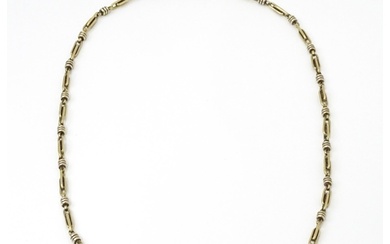 A silver and silver gilt necklace. Approx. 20" long