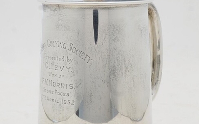 A silver tankard with glass base, Sheffield, 1931, Viner's Ltd (Emile Viner), engraved to front SCREEN GOLFING SOCIETY Presented by G. LEVY WON BY F.V. MORRIS STOKE POGES 17TH APRIL 1932, 12.5cm high, gross weight 16.9oz