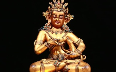 A stunning gilt bronze statue of the Mammon inlaid with gems