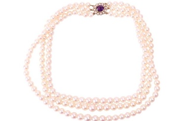 A three-strand cultured pearl necklace, comprising three rows of graduating round pearls with cream