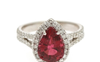 NOT SOLD. A tourmaline and diamond ring set with a pear-shaped tourmaline encircled by numerous...