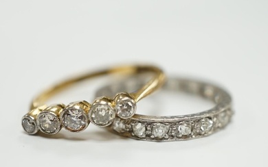 A white metal and diamond chip set full eternity ring and an...
