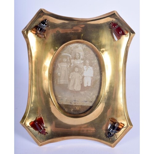 AN ARTS AND CRAFTS BRASS AND AGATE PHOTOGRAPH FRAME inset a ...
