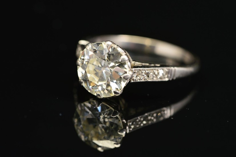 AN EARLY TO MID 20TH CENTURY LARGE DIAMOND SINGLE STONE RING...