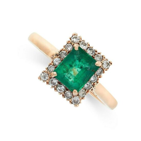 AN EMERALD AND DIAMOND RING set with an emerald cut