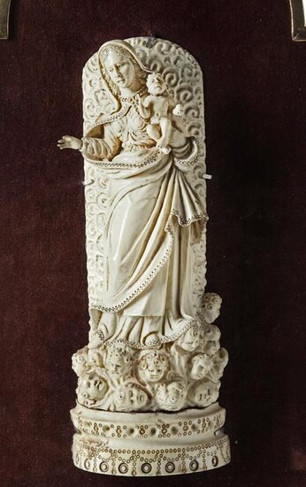 AN INDO-PORTUGUESE CARVED IVORY FIGURE OF THE MADONNA