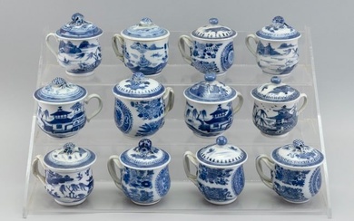 ASSEMBLED SET OF TWELVE CHINESE EXPORT BLUE AND WHITE PORCELAIN POTS DE CR?ME 19th Century Heights