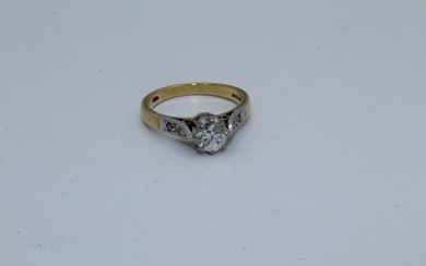 An 18ct diamond solitaire ring. Set with a principal stone...