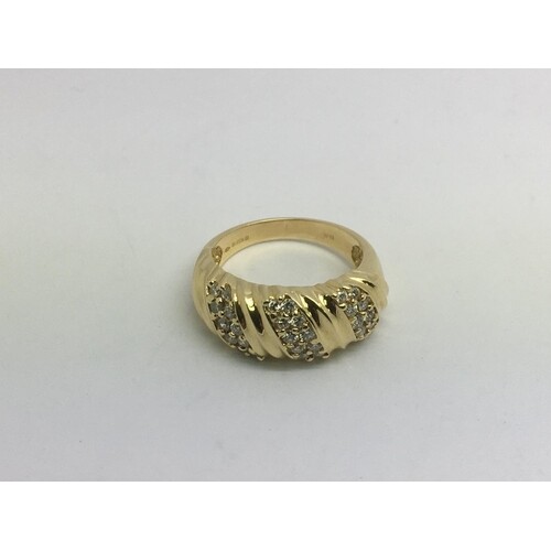 An 18ct gold ring set with thirty small diamonds, approx 7.5...