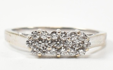 An 18ct white gold and diamond ring. The ring set with three...