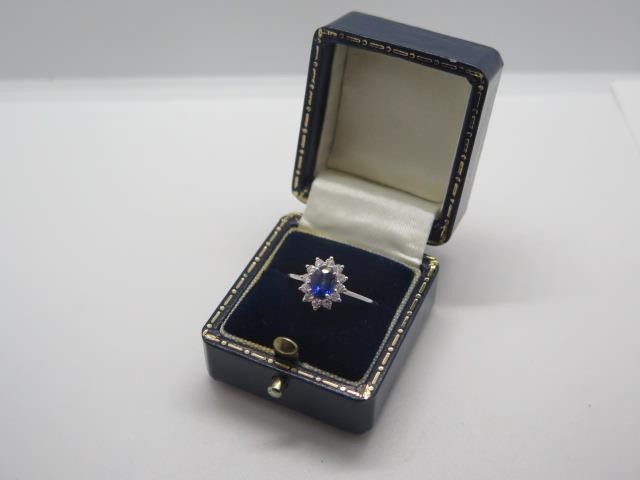 An 18ct white gold sapphire and diamond ring, size L, approx...
