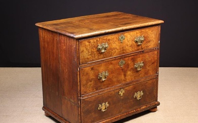 An 18th Century Oak & Walnut Veneered Chest of Drawers. The three long cock-beaded drawers clad in r