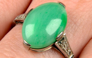 An Art Deco platinum and 18ct gold A-type jade cabochon and diamond ring.