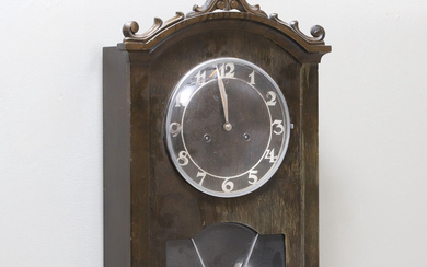 An Art Nouveau wall clock, decorated birch, early 20th century.