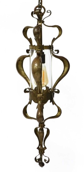 An Arts and Crafts brass hanging hall lantern