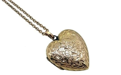 An Edwardian 9ct gold hinged heart locket and chain, floral engraving to the front and reverse