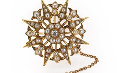 An Edwardian seed pearl and diamond starburst brooch/pendant