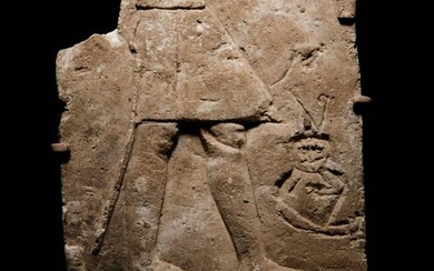 An Egyptian Limestone Sculptor's Model or Votive Relief