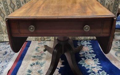 An early 19th Century Mahogany Dropleaf Side Table on quatre...
