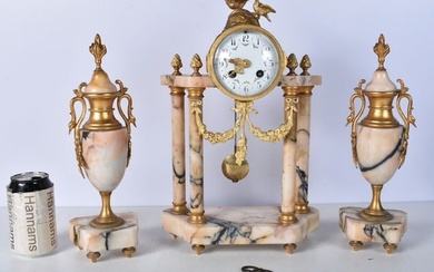 An early 20th Century French gilt metal and marble Clock set with a metal enamelled clock face