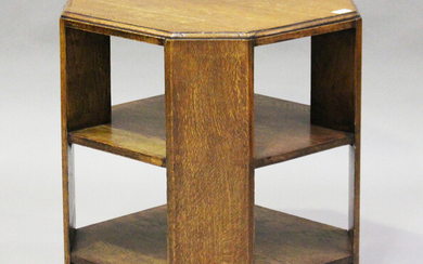 An early 20th century oak canted square book table, in the manner of Heals, height 61cm, width 53cm.