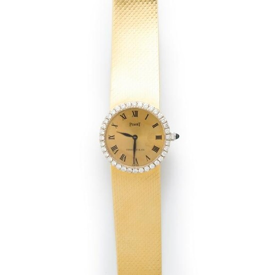 An eighteen karat gold and diamond bracelet watch