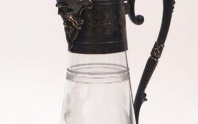 An etched glass ewer designed with silver plated mount and handle, the tapering cylindrical body decorated with etched Roman warriors to stylised foliate handle, 30.5cm high